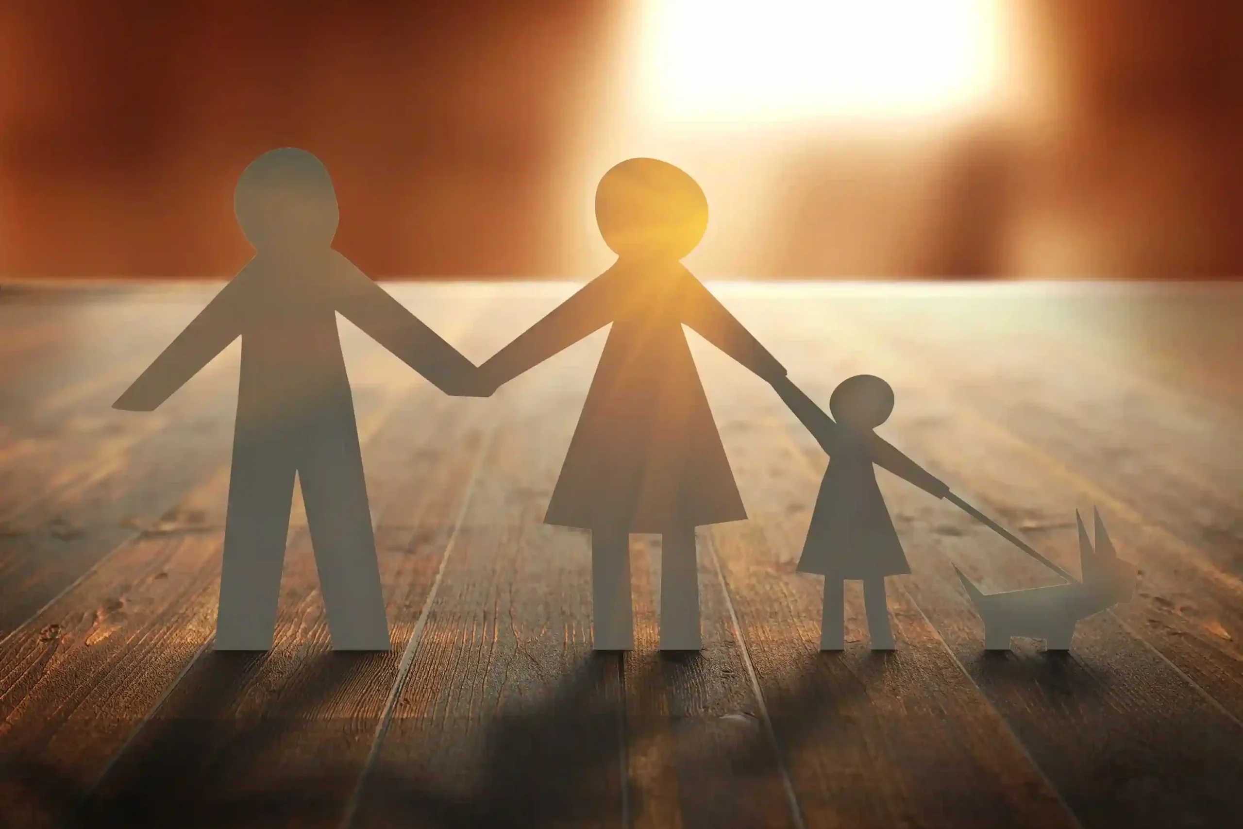 paper-family-wooden-table-sunset_11zon